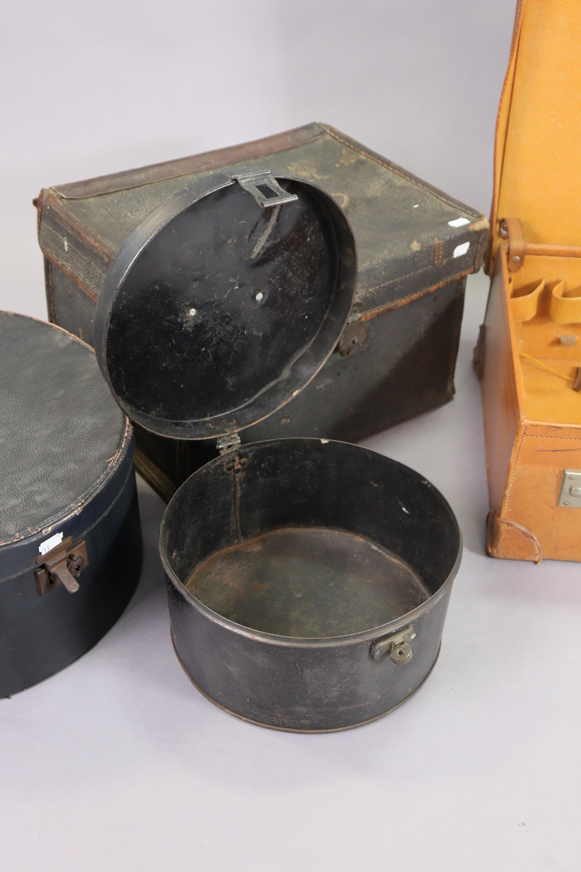 A vintage japanned-metal hatbox, 26.5cm diameter; together with another hatbox; a tan leather - Image 2 of 5