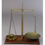 A vintage set of Avery’s of Birmingham brass balance beam scales to weigh 2lb mounted on a