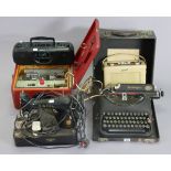A Remington portable typewriter; two Roberts radios; a Singer electric sewing machine, etc.