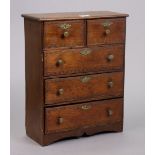 An early 20th century oak collector’s chest fitted two short & three long drawers with brass knob