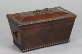 A Victorian mahogany work box of sarcophagus form, with carved rosebud handle to the hinged lid,