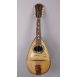 An Italian mandolin, Bears paper label “Felice Cavalacci & Figlio, Napoli”, 60cm long, lacking case.