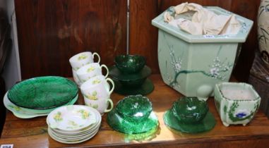 A Shelley bone china “Primrose” nineteen-piece part tea service; a ditto ashtray; four moulded green