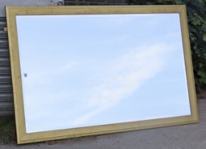 A large gilt frame rectangular wall mirror inset with a bevelled plate, 166cm x 105cm.