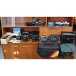 Four various cameras, various camera accessories & cases.