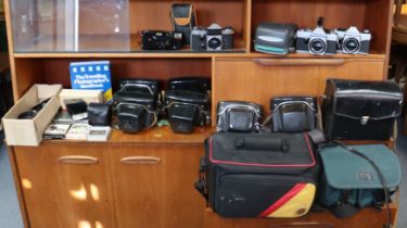 Four various cameras, various camera accessories & cases.
