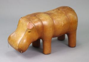 A tan leather novelty Hippo footstool, 76cm long x 38cm high (lacking one ear, over-all wear).
