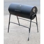 A drum charcoal barbecue, 76cm wide x 90cm high.
