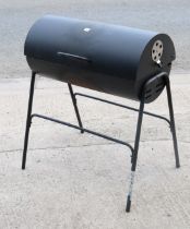 A drum charcoal barbecue, 76cm wide x 90cm high.