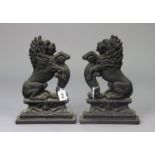 A pair of Victorian-style black painted cast-iron rampant-lion doorstops, 35.5cm high.