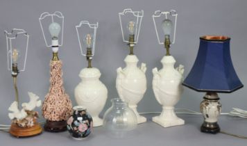 Seven table lamp bases each with shade.