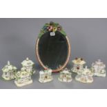 A barbola-type oval dressing table mirror on an easel support, 35.5cm x 25cm; & eight Coalport