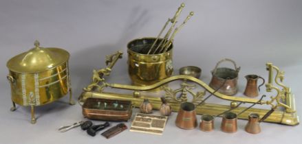 A brass fender with pierced & shaped front, 130cm long; two brass coal-boxes; a set of three brass