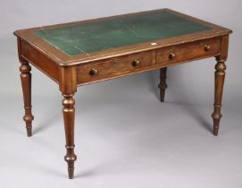 A Victorian mahogany writing table inset tooled green leather, fitted two frieze drawers, & on