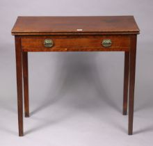 A George III mahogany tea table with a rectangular fold-over top, fitted frieze drawer, & on