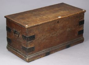 A Victorian iron-bound oak blanket box with a hinged lift-lid, & with wrought-iron side handles,