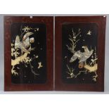 A pair of Chinese lacquer work large panels each with a raised composition design of a bird