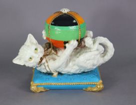 A William Brownfield model of a cat, playing with a brocaded ball forming a bowl & cover, laying