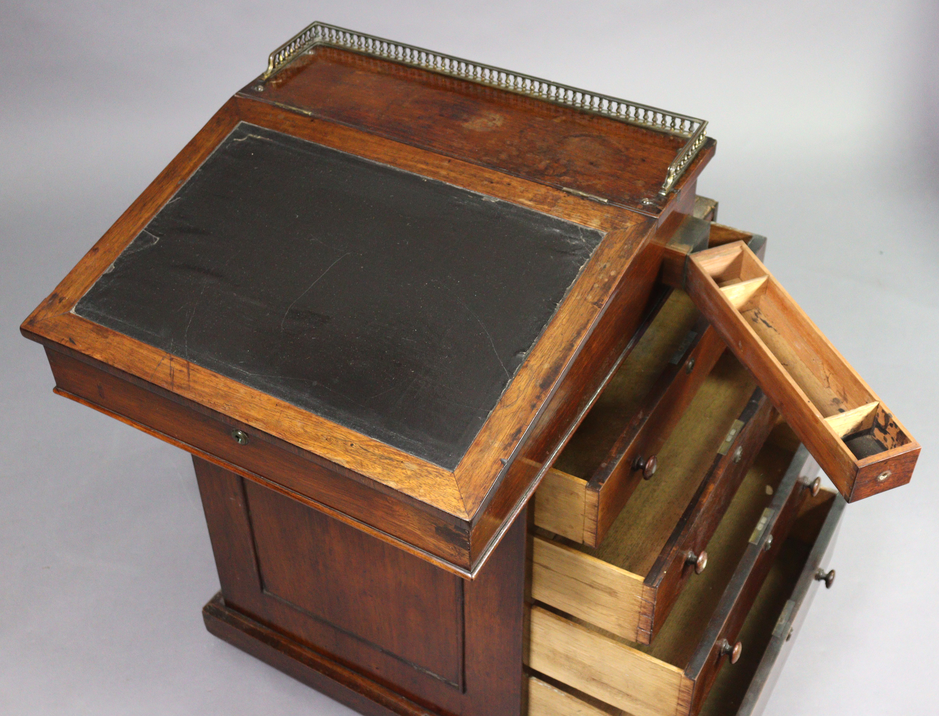 An early 19th century rosewood davenport, the forward-sliding top with brass gallery & long hinged - Image 2 of 9