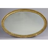 A George III giltwood & gesso oval wall mirror inset later bevelled plate, 93cm x 60cm (various