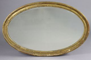 A George III giltwood & gesso oval wall mirror inset later bevelled plate, 93cm x 60cm (various