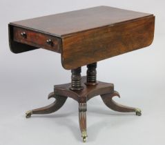 A regency mahogany Pembroke table fitted with a frieze drawer to one end on twin-turned pedestal