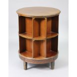 An early/mid-20th century mahogany circular revolving bookcase by Jolly & Son of Bath, with carved