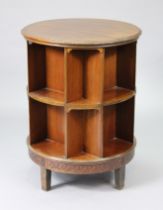 An early/mid-20th century mahogany circular revolving bookcase by Jolly & Son of Bath, with carved