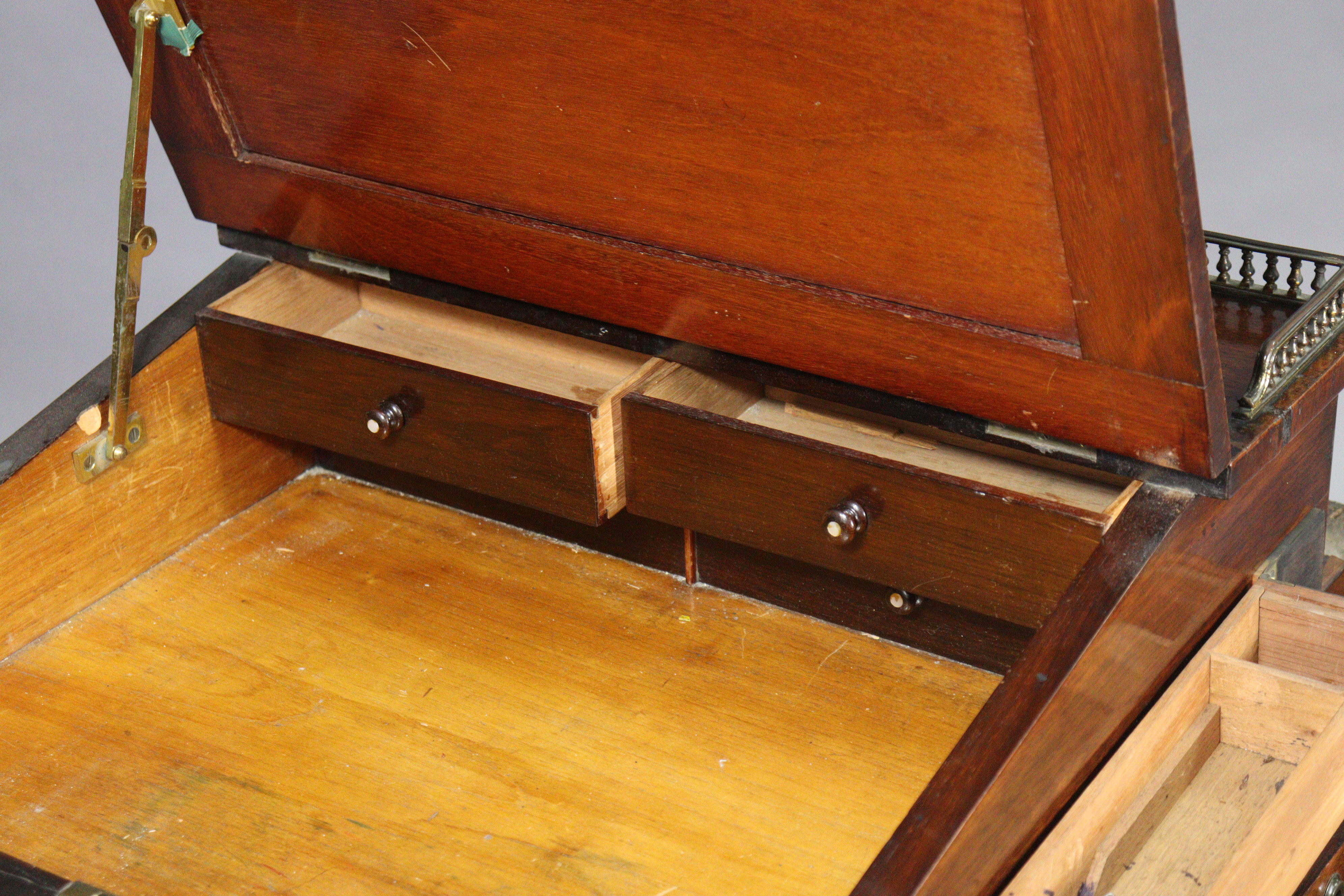 An early 19th century rosewood davenport, the forward-sliding top with brass gallery & long hinged - Image 4 of 9