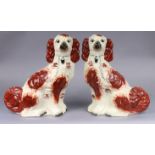 A pair of 19thC Staffordshire pottery flat-back spaniel ornaments, each 25.5cm high x 18cm wide.