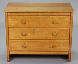 A GORDON RUSSELL LTD OAK ‘DENBIGH’ CHEST fitted three long drawers with turned handles, on plain end