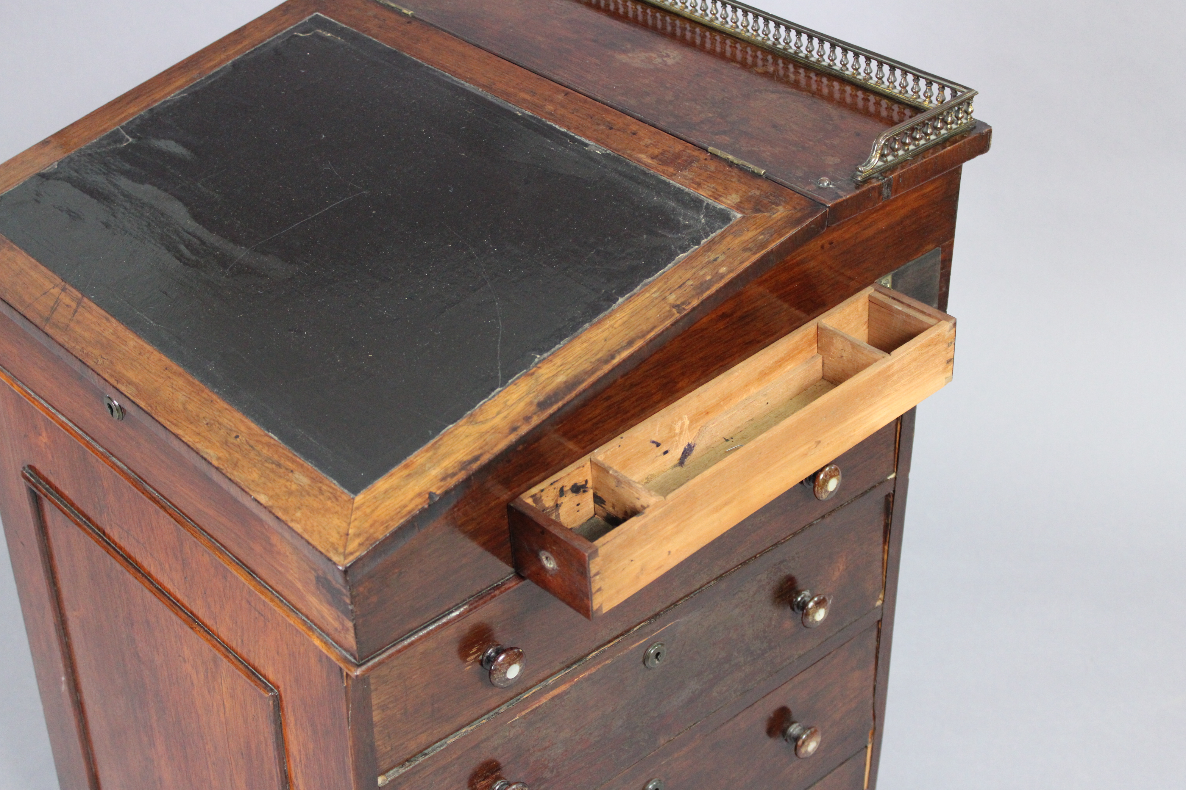 An early 19th century rosewood davenport, the forward-sliding top with brass gallery & long hinged - Image 5 of 9