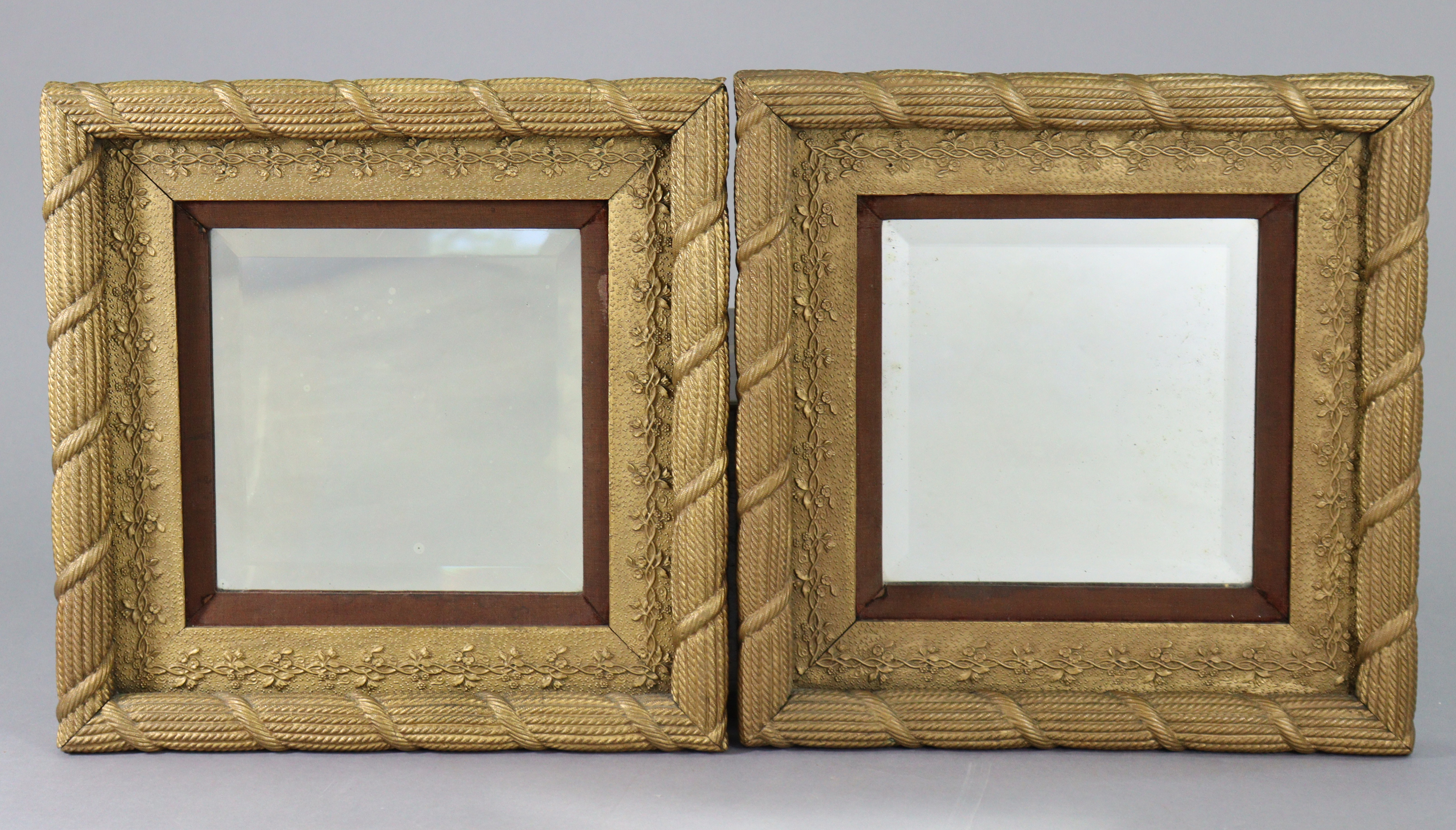 A pair of 19th century giltwood & gesso rectangular wall mirrors, inset bevelled plates in rope-