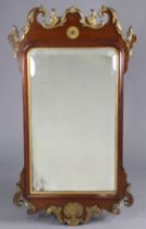 A George II style fret-carved mahogany & parcel gilt rectangular wall mirror, inset bevelled