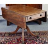 A regency mahogany drop-leaf table fitted with a frieze drawer to one end with turned knob