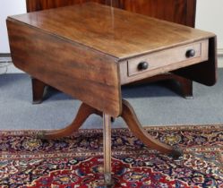 A regency mahogany drop-leaf table fitted with a frieze drawer to one end with turned knob