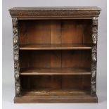 A Victorian carved oak standing open bookcase having three adjustable shelves, on plinth base, 107cm