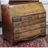A late 18th century figured mahogany bureau, the sloping fall-front enclosing fitted interior, three