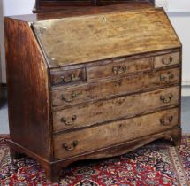 A late 18th century figured mahogany bureau, the sloping fall-front enclosing fitted interior, three