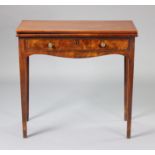 A mahogany tea table with rectangular fold-over top above a frieze drawer with brass knob handles,