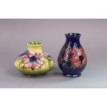 Two Moorcroft pottery Anemone pattern small vases, one of yellow/green ground & squat baluster