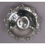 A Tiffany & Co. sterling circular shallow dish, the cast & pierced shaped rim decorated with