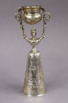 A late 19th century continental silver (.930 standard) Wager cup, the female figure of traditional