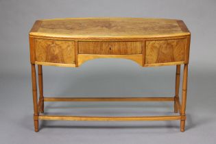 A 1920’s/1930’s art deco inlaid side table fitted three frieze drawers on turned supports with