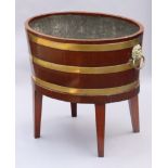 A regency mahogany & brass-bound wine cooler, with lead-lined interior & brass lion-mask ring side
