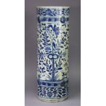 A 19th century Chinese blue & white porcelain stick-stand, the cylindrical body all-over painted