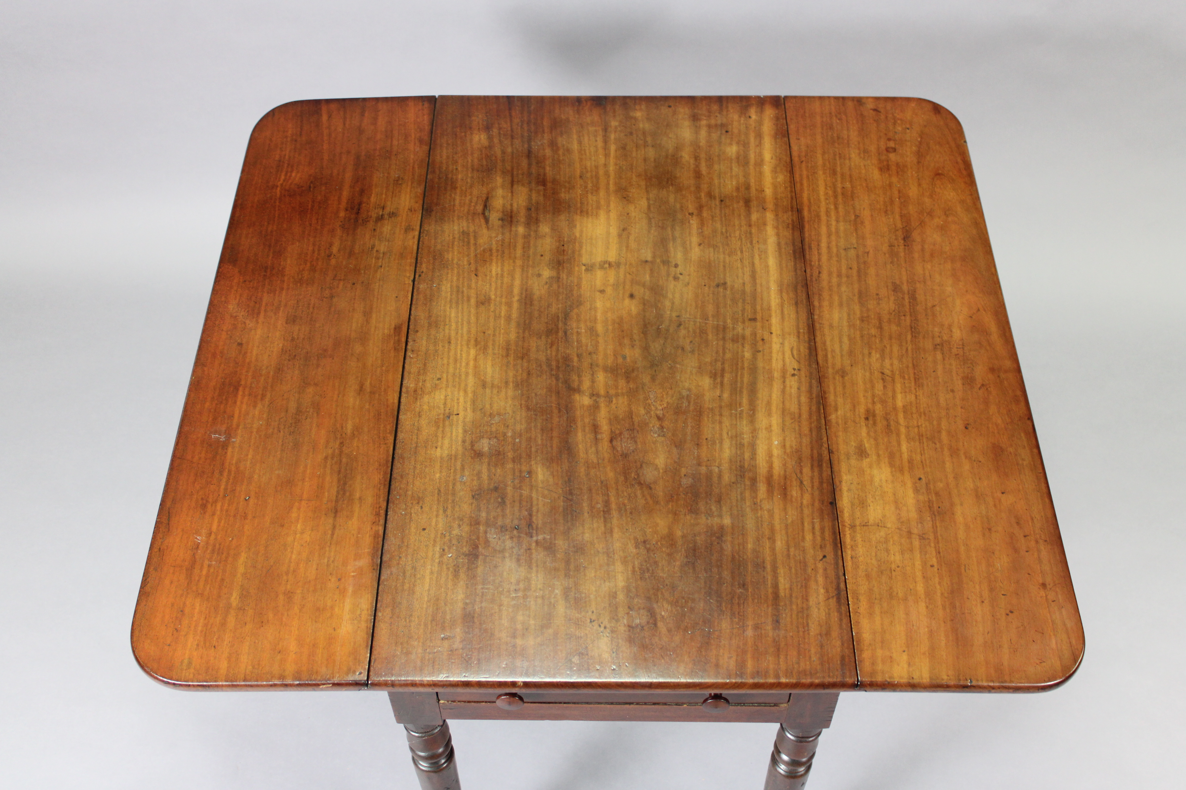 A Victorian mahogany Pembroke table, fitted with a drawer to one end, on turned tapering legs with - Image 2 of 4