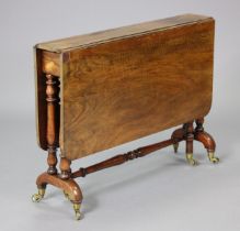 A mid-Victorian walnut Sutherland table on turned end supports, with brass toes & ceramic castors, o