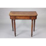 A regency mahogany side table with rounded corner to the plain rectangular top, on turned tapering