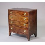 A 19th century mahogany small chest fitted four long graduated drawers with brass oval swing